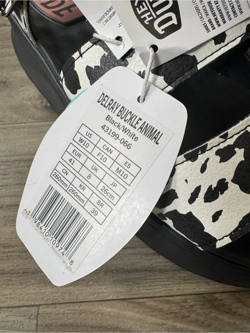 Hey Dude Delray Buckle Platform Sandal in Black/White Animal Cow Print Size 10